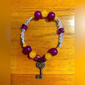Handmade glass beaded stretch bracelet skeleton key charm